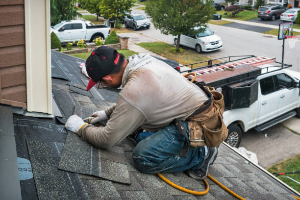 Professional Roof Replacement technician working in Saxton, PA